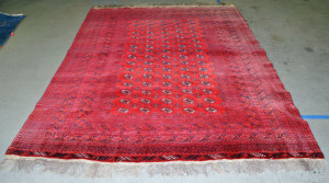 red rug showing sun fading