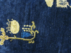 close up photo of white knots on blue rug