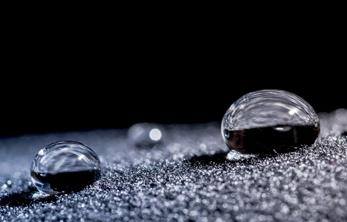 Drops of water close-up macro on velvet material